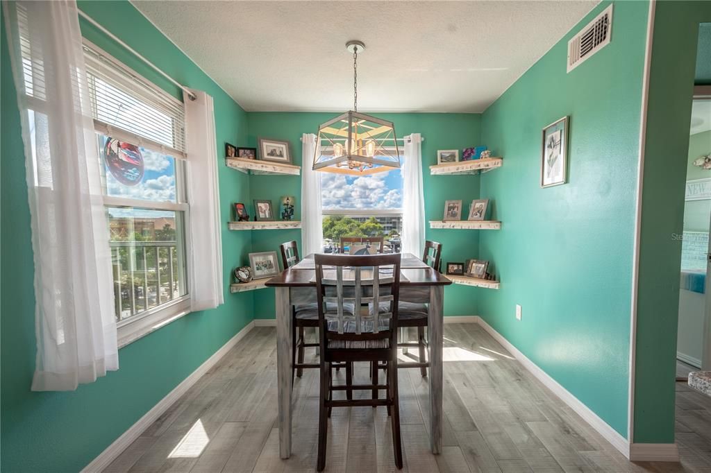 Corner shelves frame the window with marina views.