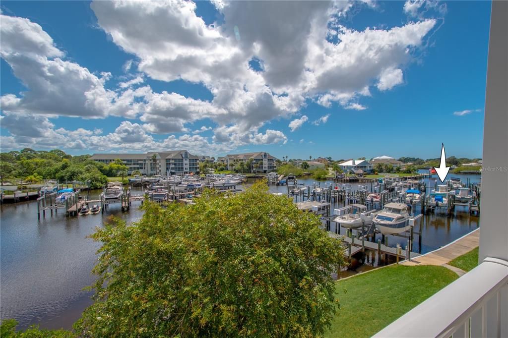 A view of the marina from the balcony. The arrow indicates where the deeded boat slip #224 is. It has a 7000 lb lift and includes a wireless remote w/ auto stop