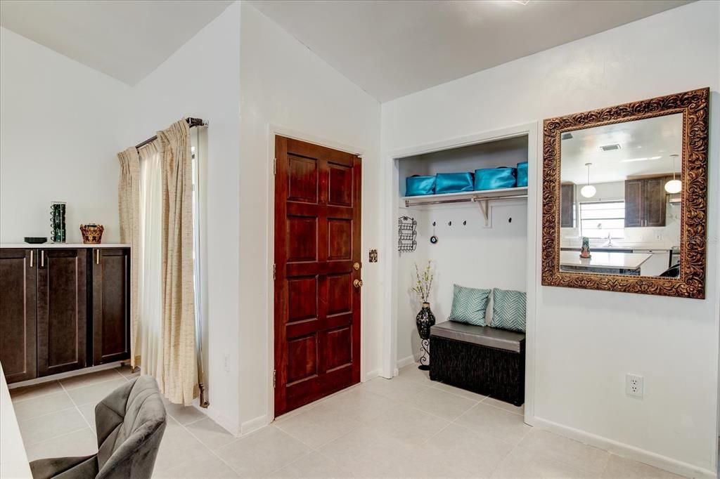 Foyer with converted closet vestibule area.