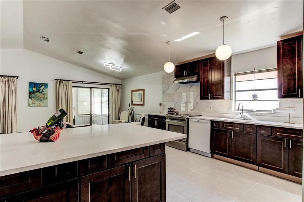 New cabinets and lighting accent the open kitchen concept.