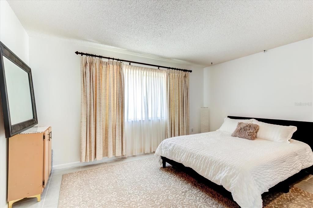 Primary bedroom with king size bed.