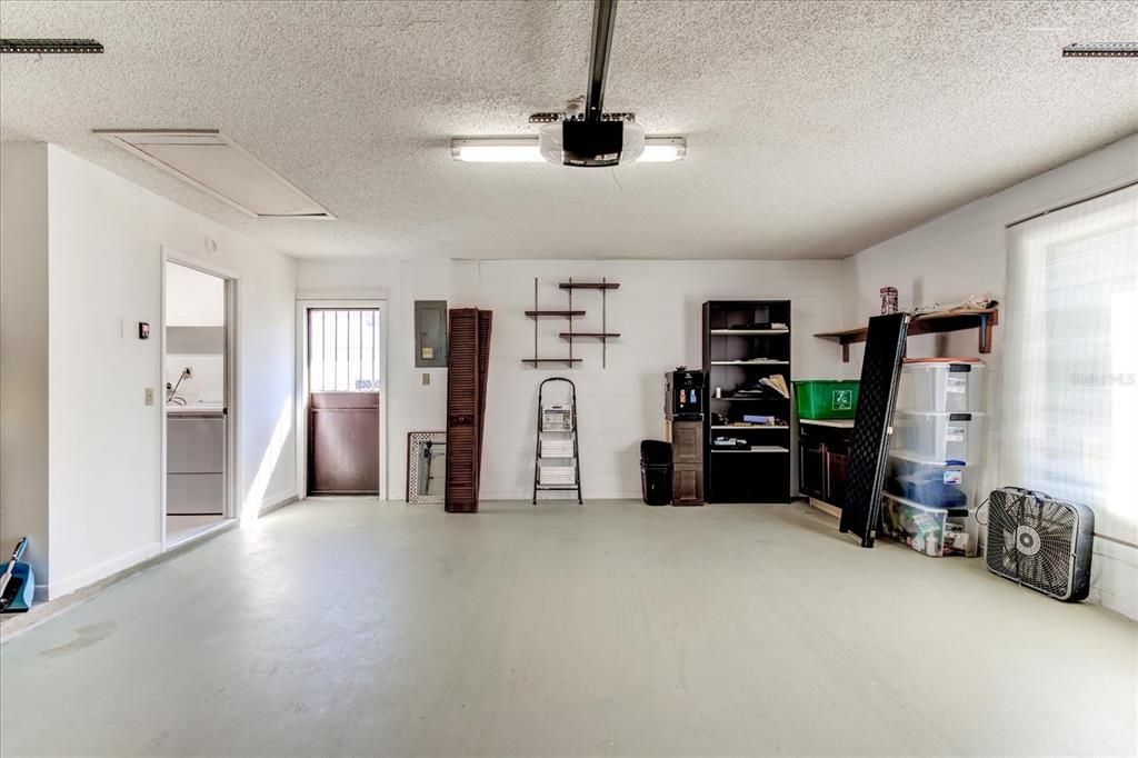 Spacious 2 car garage leading into the indoor laundry room.