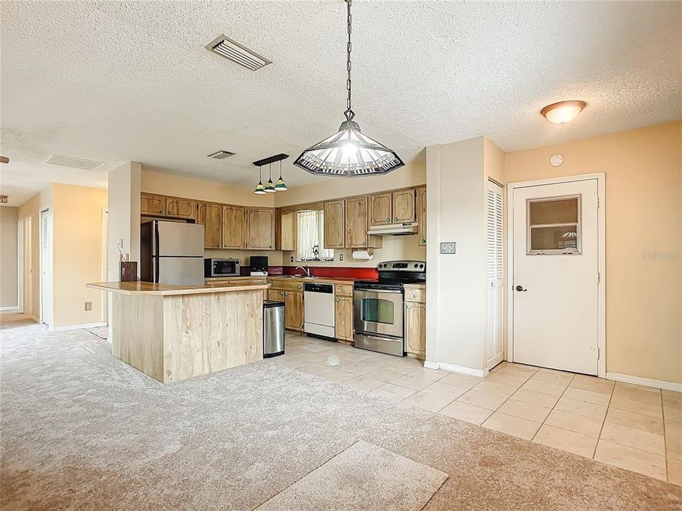 open concept kitchen , living room and dining room