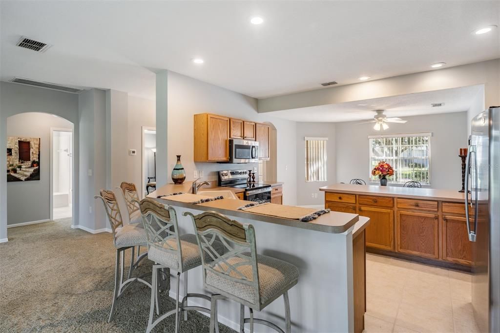 Breakfast highbar in this kitchen Loaded with cabinets!