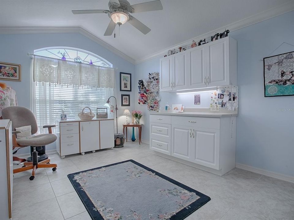 Front Bedroom with Built-in Upper and Lower Cabinets Eyebrow Window Accent