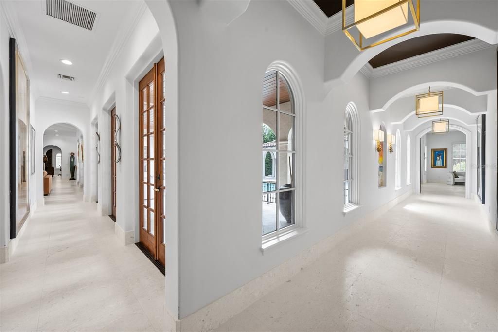 Hallway leading to primary bedroom