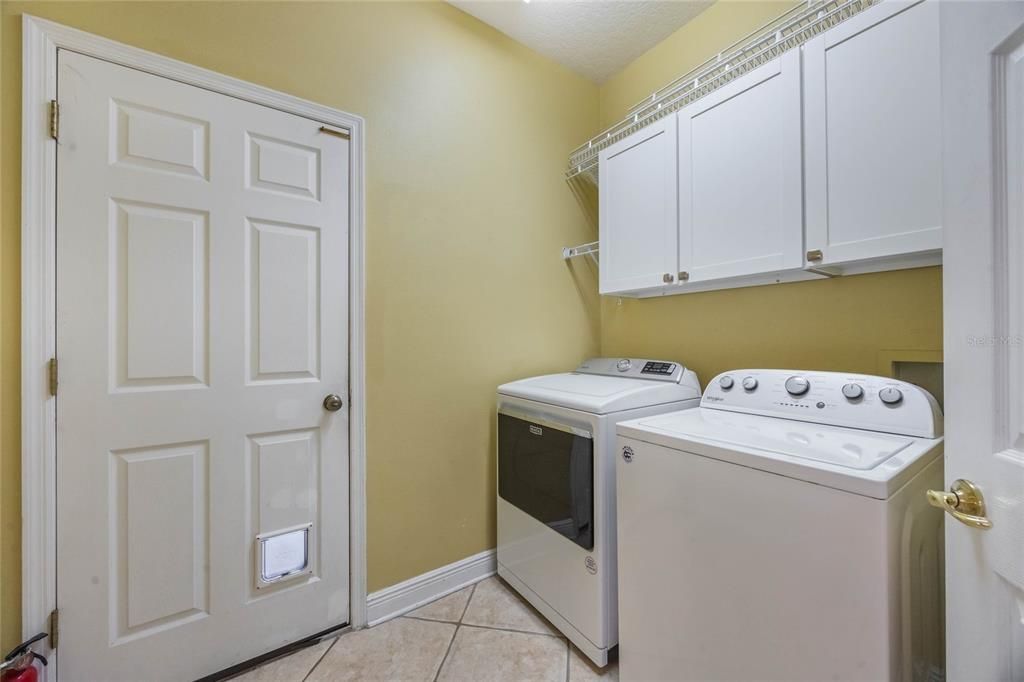 Laundry room conveniently located off of the garage before entering eat-in kitchen area. Washer and dryer will stay as courtesy to tenant.