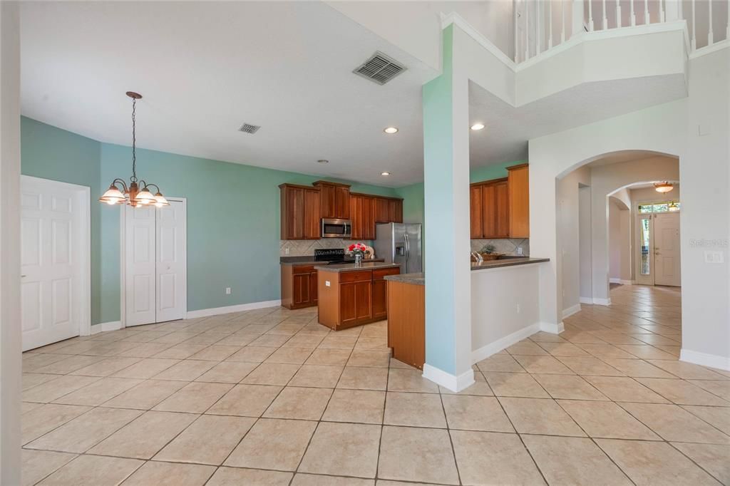 Kitchen and eat-in area with pantry and door to laundry room/garage.