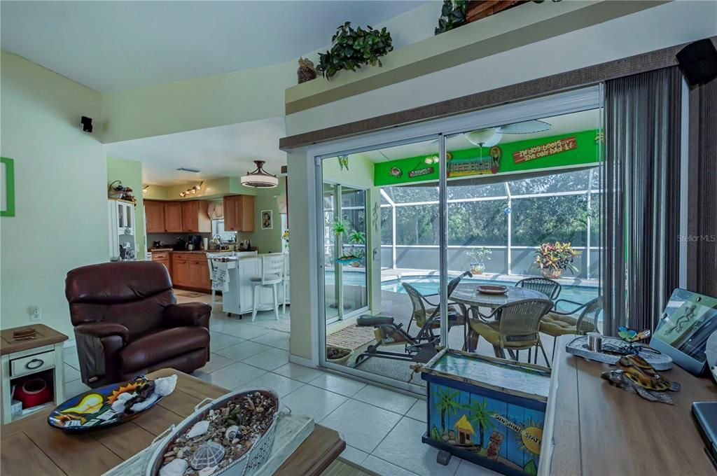 Great room with sliding doors to patio and pool area