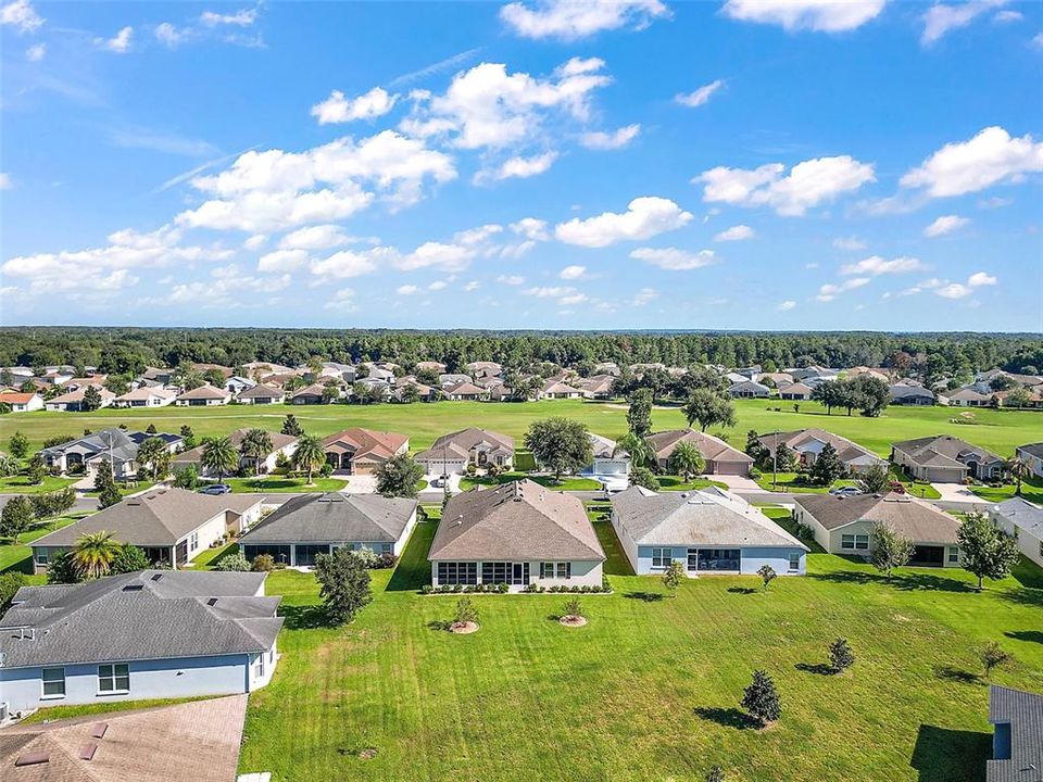 The Lot is 65 Ft  Wide in the Front, Right side of house is 170.13 Ft Deep, Left side is 143.27 Ft. Long,and along the Back 55.9 Ft Wide.  Plenty of room for a Pool With Birdcage.