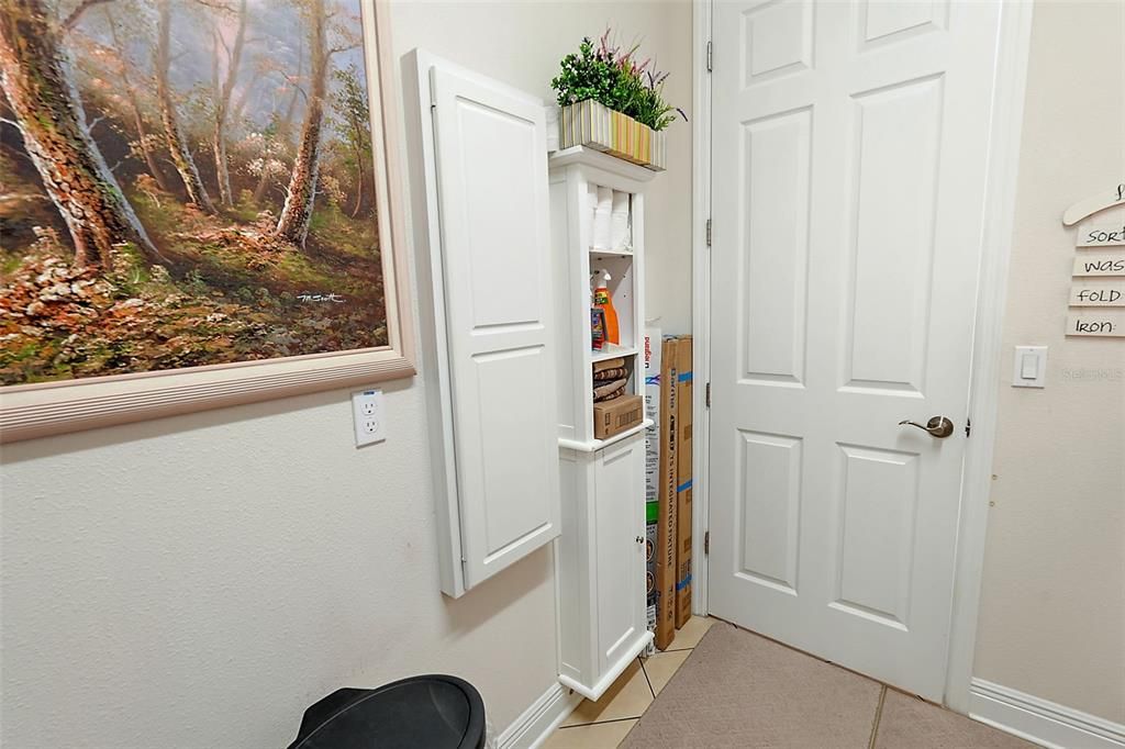 We are still in the laundry room, Custom Cabinet to hold whatever you need it to. Not to mention the built in Iron Board that is in the cabinet on the wall.