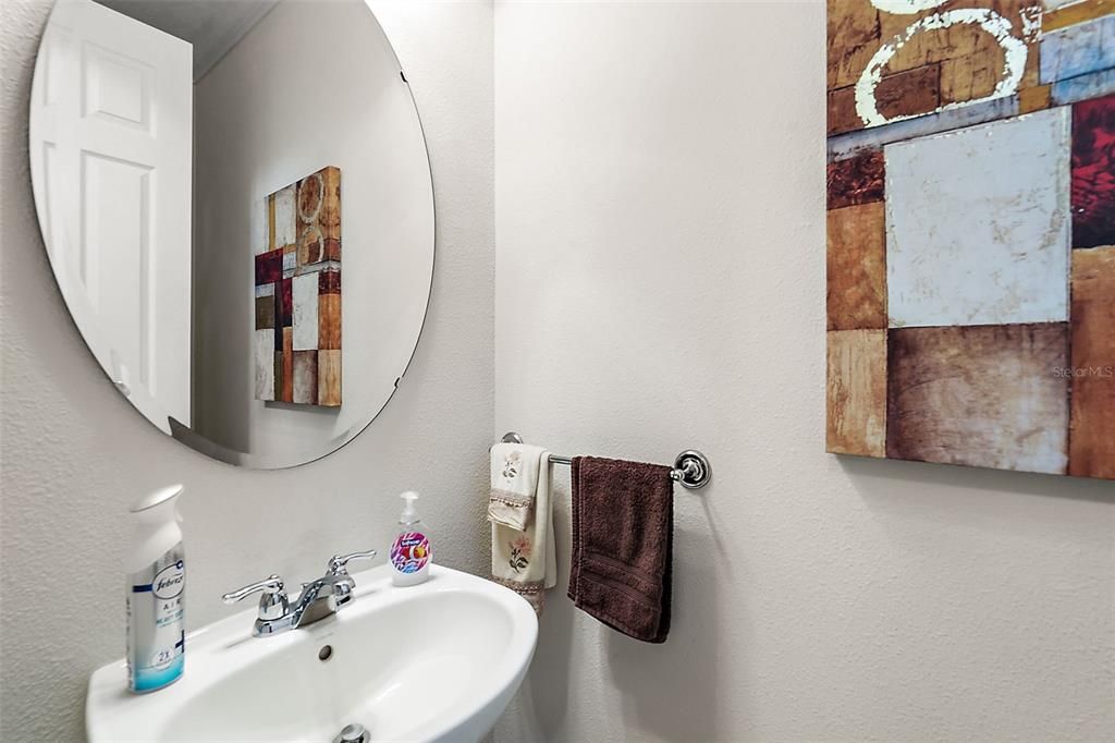 Off the Foyer Corridor there is a Charming two piece Half Bath.