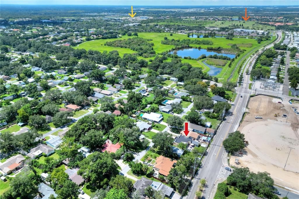 tThis home in the foreground looking west toward the Lakeside Village outdoor shopping and dining area and Grasslands golf course on the horizon.