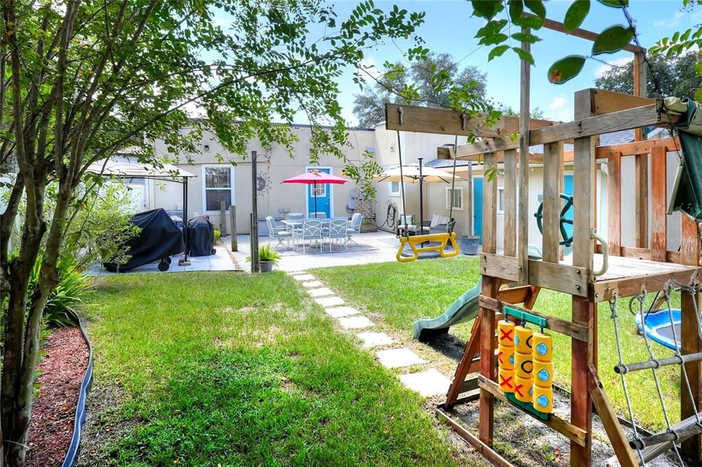 Peaceful and fun, sun and shade, amnd a view of kitchen door as well as laundry and atached storage on the right.