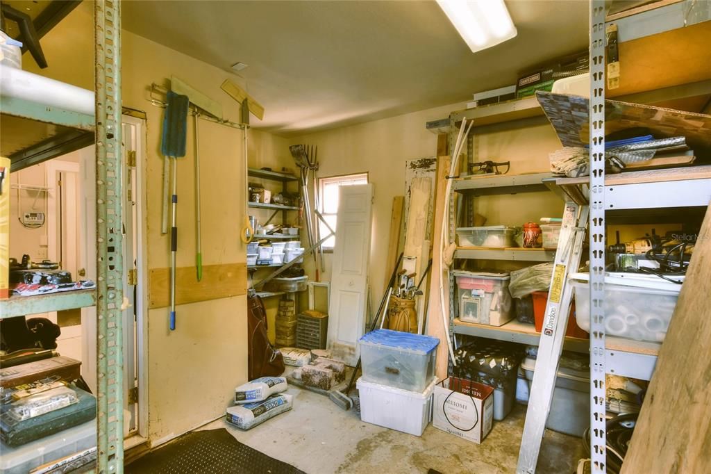 This view looks into a bonus nook/space and back into the laundry room