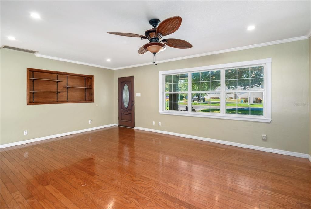 Large living room with recessed lighting and ceiling fan