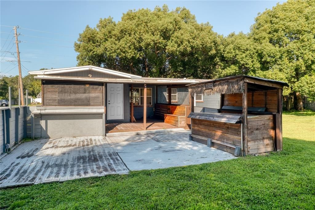 Extended back patio with tiki bar