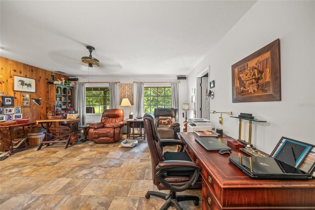 Family Room or 3rd Bedroom. There is a Bath in this room. The sellers use it as a Family Room.