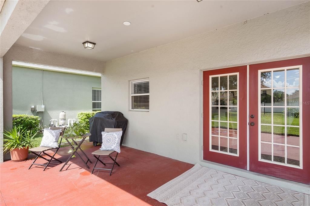 Covered Back Patio with French Doors leading into Kitchen/Family Room