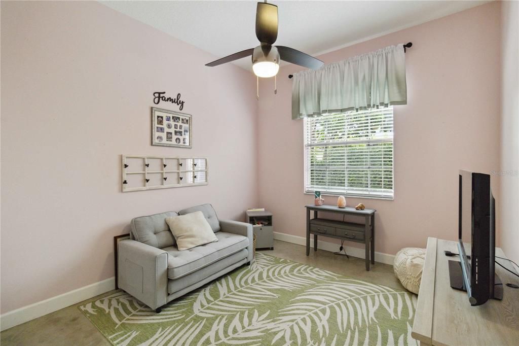 One of the guest bedrooms.  It boasts a ceiling fan & is a flex room with the option to become an office or den.