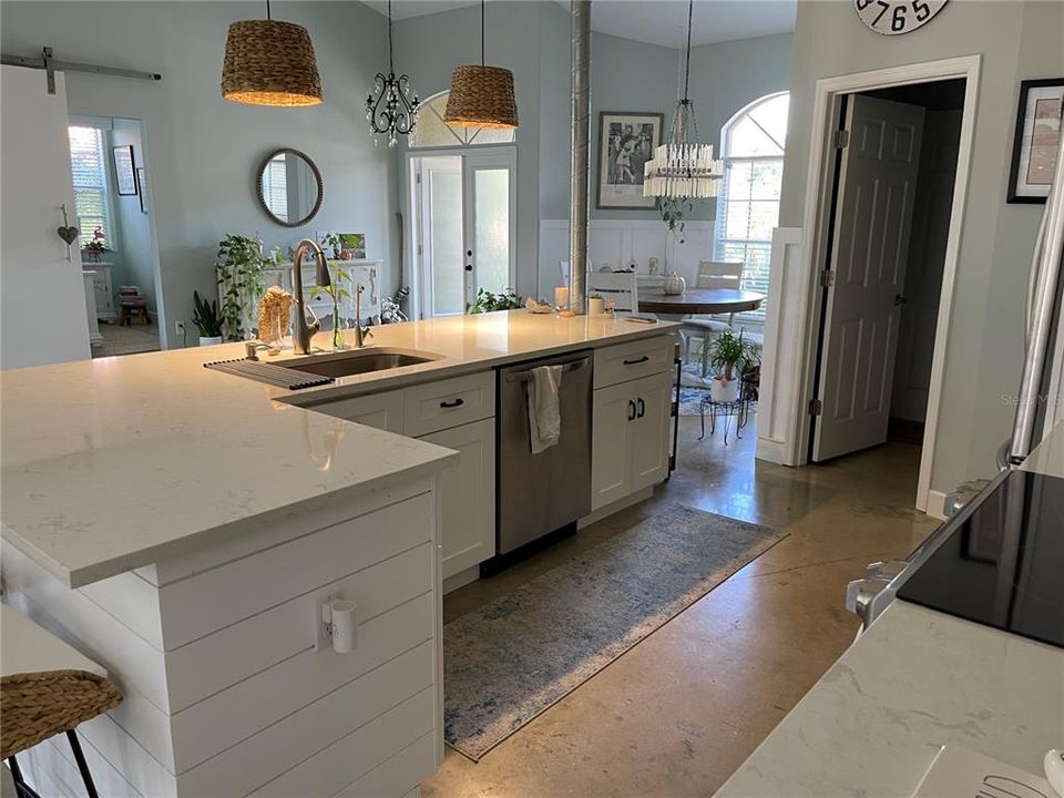 Quartz countertops in the kitchen.  For your convenience, exit to the laundry room from the kitchen