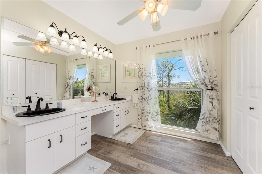 Third floor: Main bath- also updated with new lighting and new fixtures.  There's plenty of room for a dressing stool here at this vanity