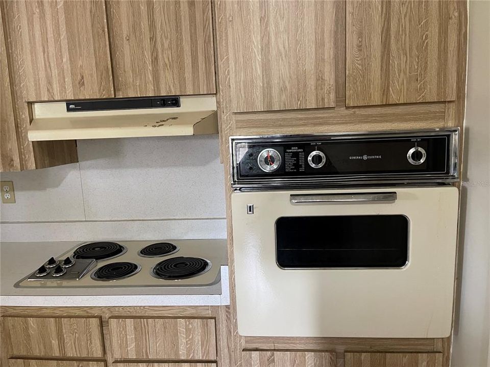 The kitchen with ample cabinet.