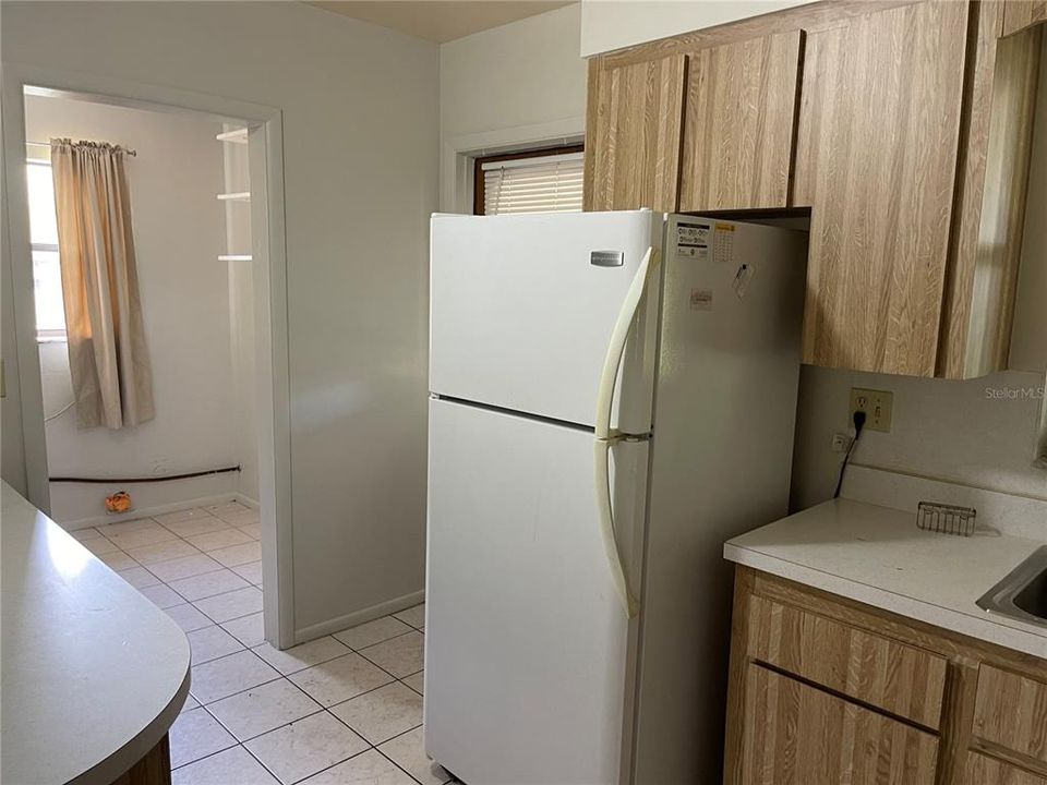 View of the kitchen and the utility room.