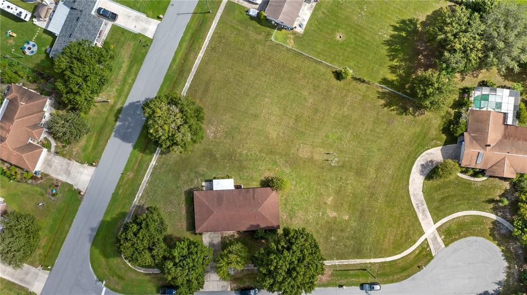 aerial view of home on a corner lot plus the vacant lot 18 nextdoor also for sale