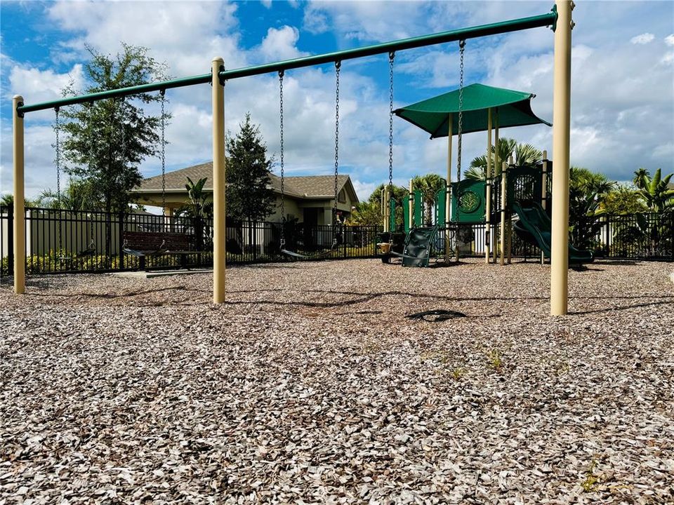 Family fun- community playground swings just off of the pool clubhouse