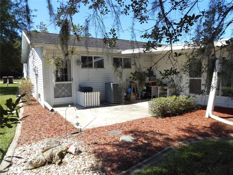 OPEN PATIO BEHIND GARAGE