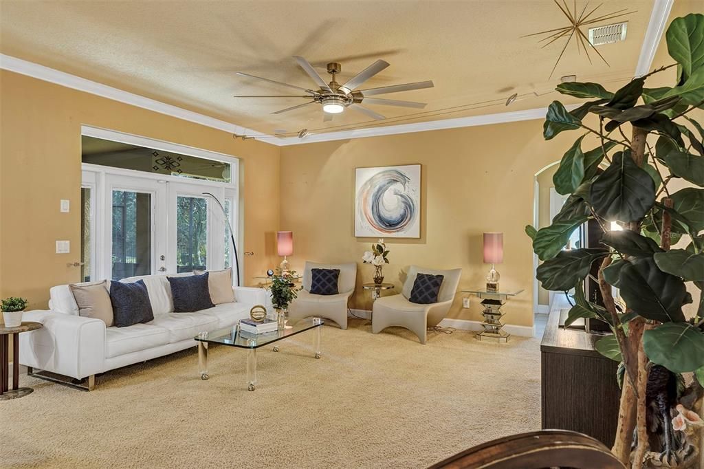 Family room/Casual living area with French Doors that lead to the patio