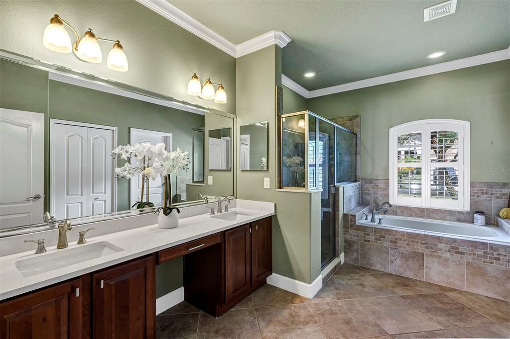 Primary Bathroom with dual sinks and quartz countertops