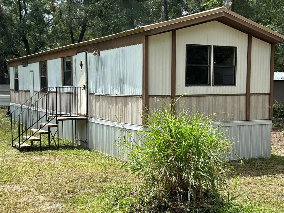 View of the front from NE corner of the house.