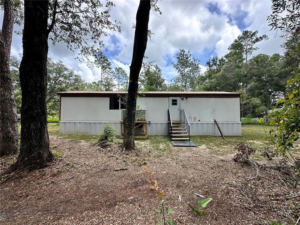 View of the back side of the house from the lot line.