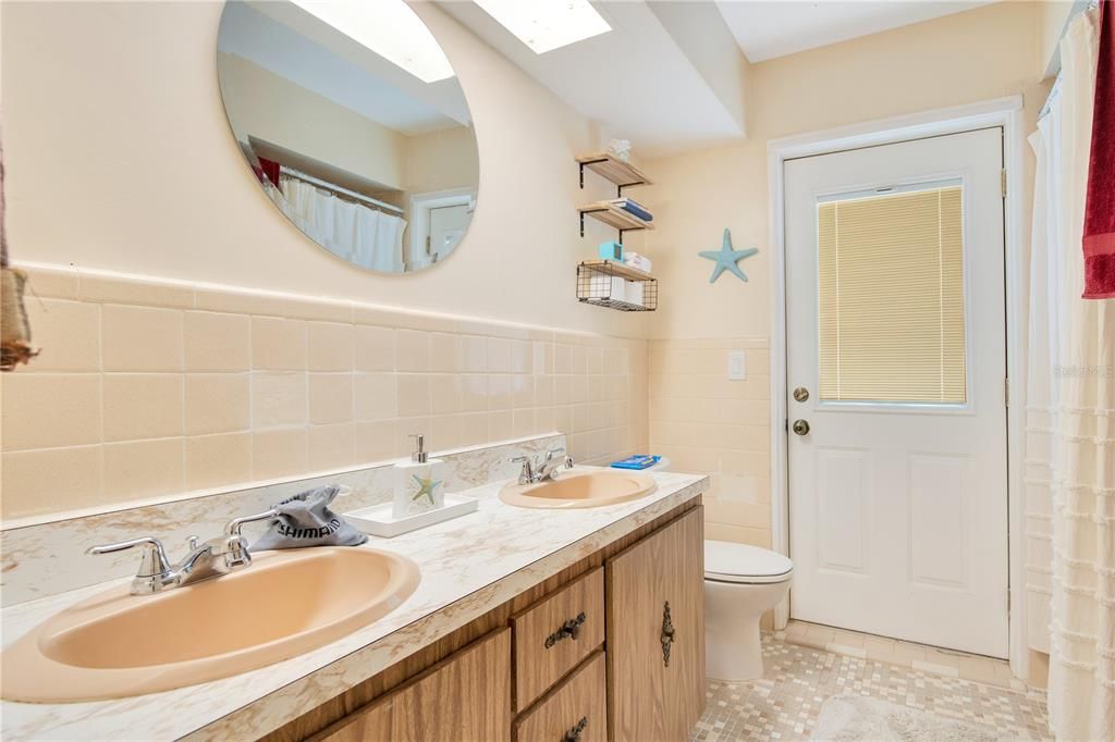 Guest bathroom with direct pool access.