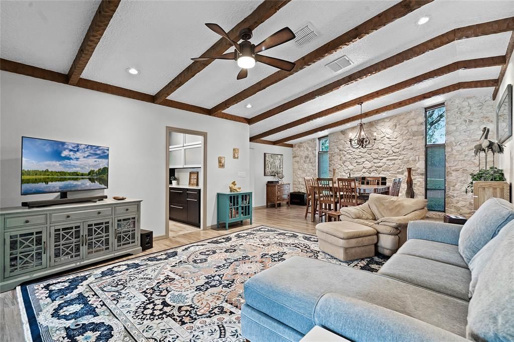 Great room boasts wood beamed ceilings