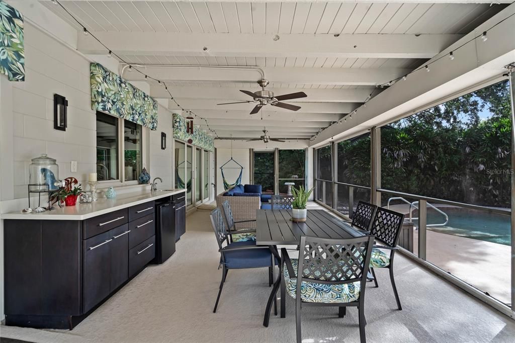 Your guests will love your 14' x 34' screened covered lanai and outdoor wet bar