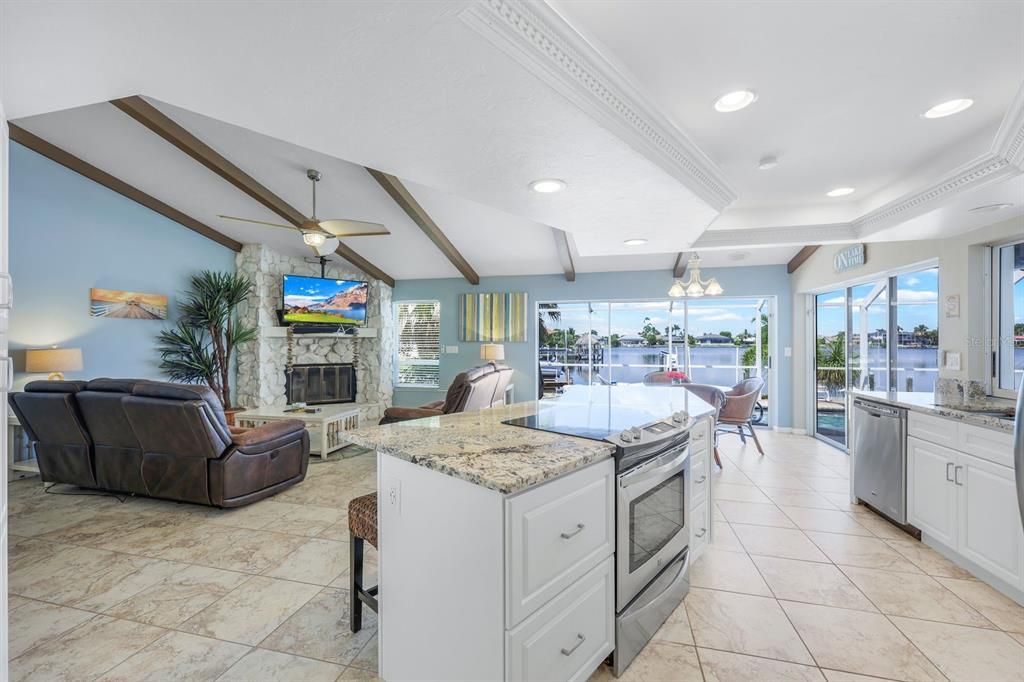 Kitchen, onlooking dining room and family room