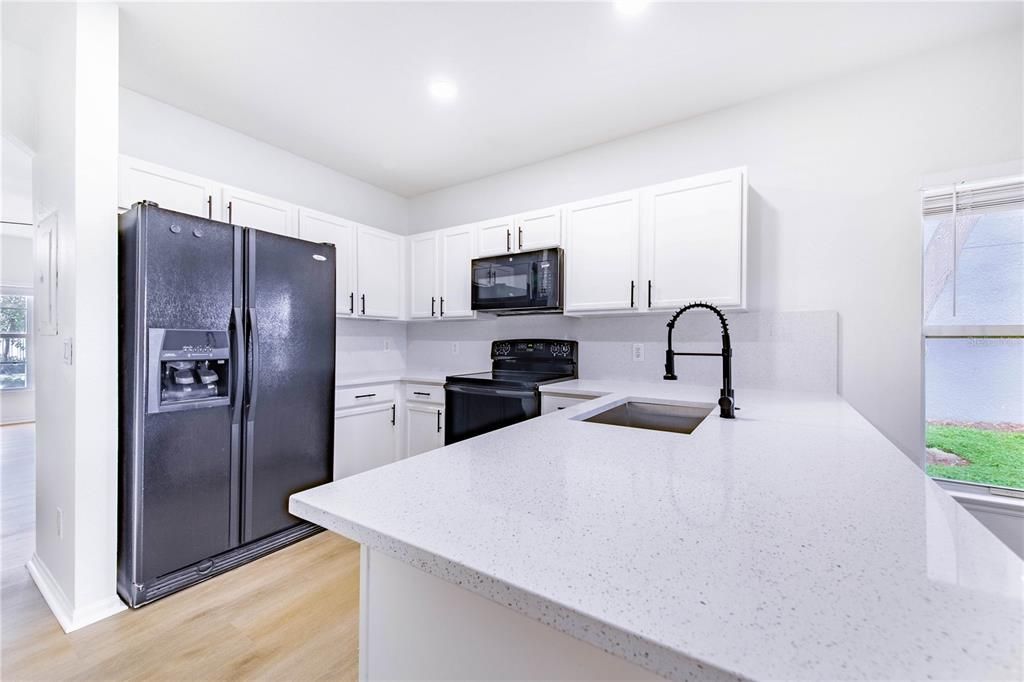 New countertops, sink, updated cabinets with new paint and hardware