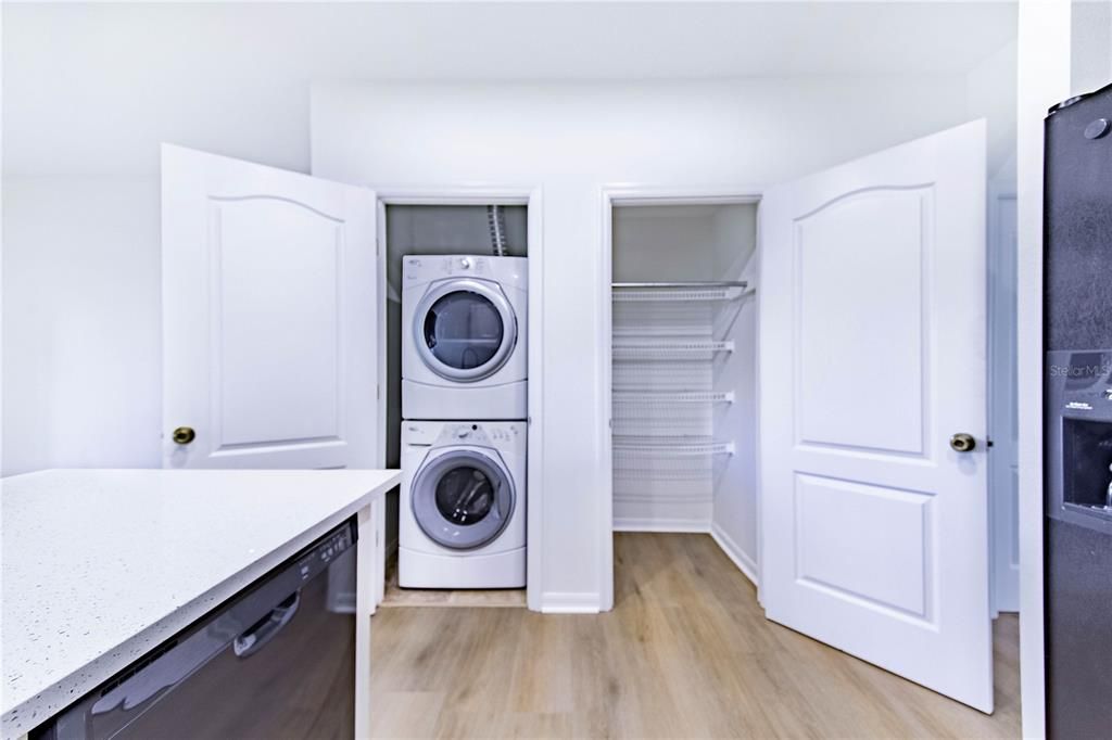 Pantry and laundry closet conveniently located across from Kitchen