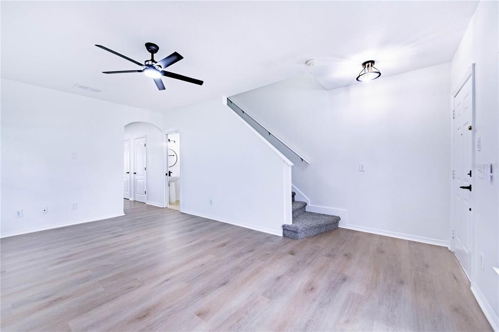 Entry into Living Dining room areas. All new paint, carpet, hardware, LPV floors, counters and so much more!