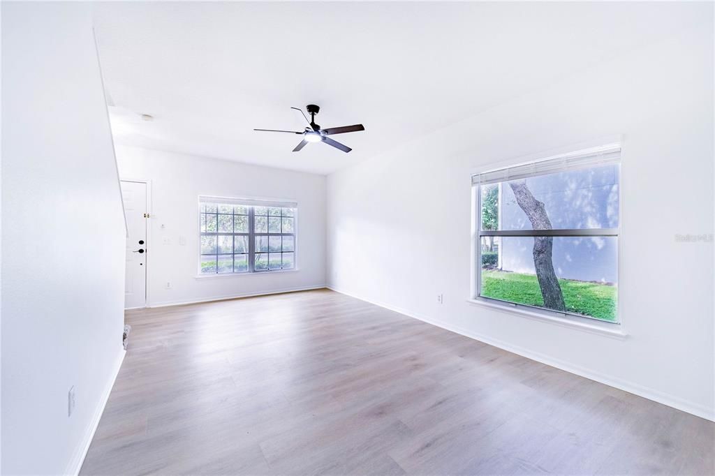 Living/ Dining room combo and new Medium oak-finish, LPV flooring throughout the first floor with tile in the powder room