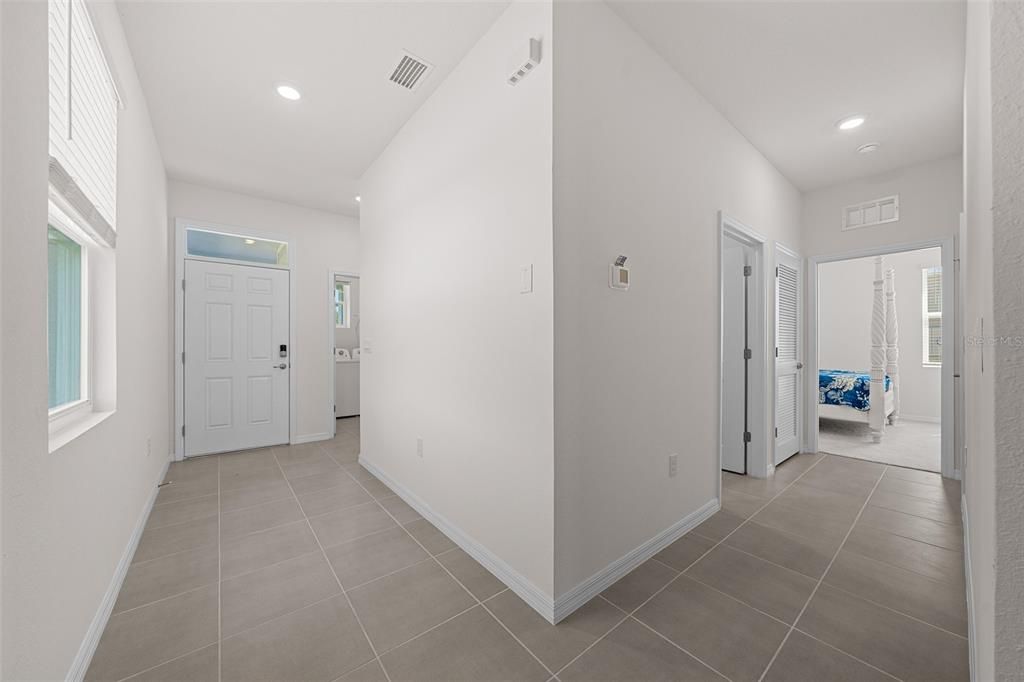 Foyer and hall way to guest bed and bath