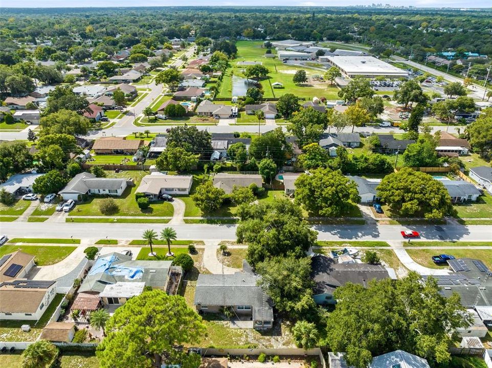 Aerial view of the rear of the home and surrounding neighborhood.