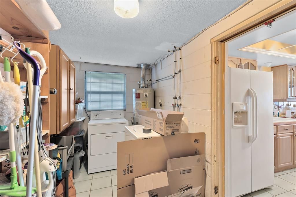 Just off the kitchen is a large walk-in pantry and your laundry room