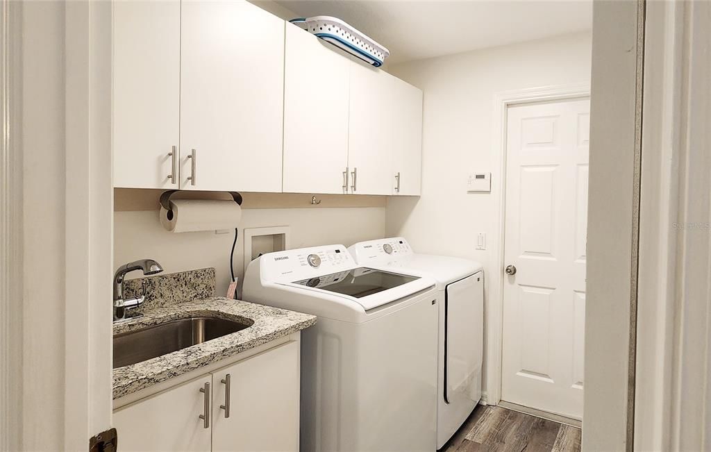 Utility Room leads to garage.