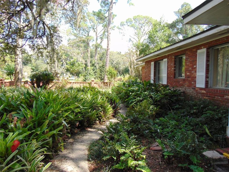 This iconic one-story brick & block home . . .