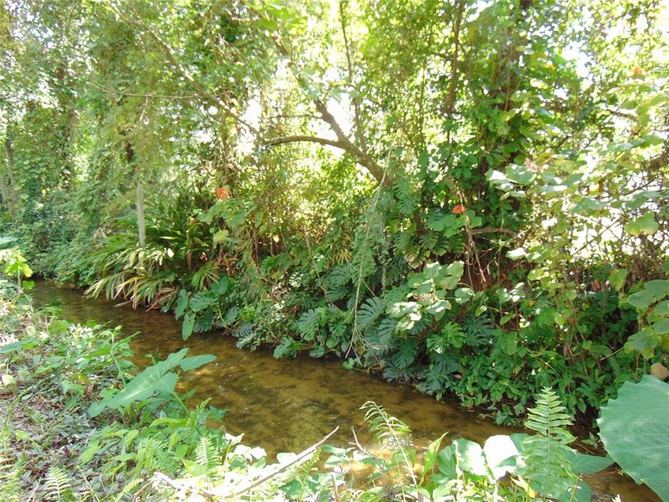 Which crosses a creek that flows toward nearby Lake Bentley.