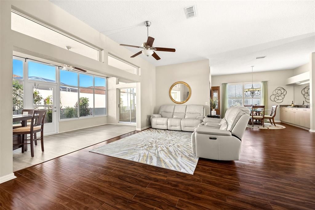 The living room provides the perfect space to gather or entertain and flows seamlessly to the FLORIDA ROOM with views of the back yard and lovely landscaping.